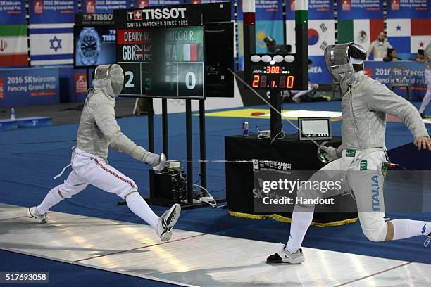 In this handout image provided by the FIE, William Deary of Great Britain and Ricardo Nuccio of Italy compete during the individual Men's Sabre match...