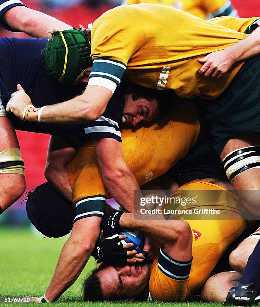 George Smith of Austalia finds himself crushed in a maul during the International Friendly match between Scotland and Australia at Hampden Parkon...