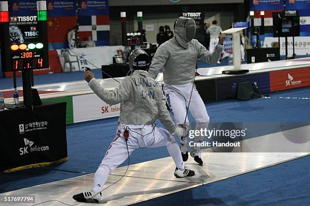 In this handout image provided by the FIE, Jianhao Liang of China and Alberto Pellegrini of Italy compete during the individual Men's Sabre match...