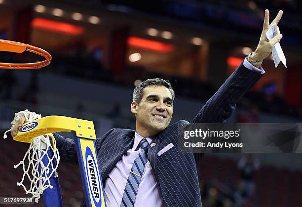 Head coach Jay Wright of the Villanova Wildcats celebrates defeating the Kansas Jayhawks 64-59 during the 2016 NCAA Men's Basketball Tournament South...