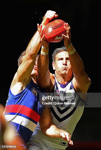 Matthew Pavlich of the Dockers marks infront of Dale Morris of the Bulldogs during the round one AFL match between the Western Bulldogs and the...