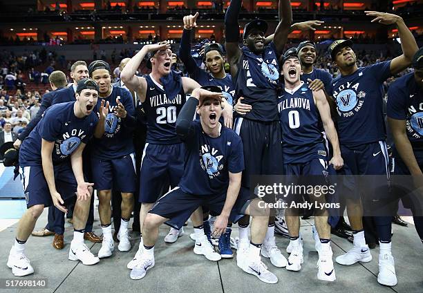 The Villanova Wildcats celebrate defeating the Kansas Jayhawks 64-59 during the 2016 NCAA Men's Basketball Tournament South Regional at KFC YUM!...