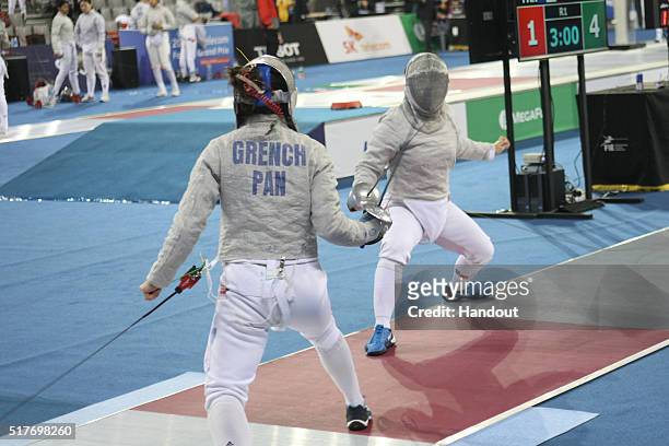 In this handout image provided by the FIE, Eileen Grench of Panama and Cho Ju-Yeon of Korea compete during the individual Women's Sabre match during...