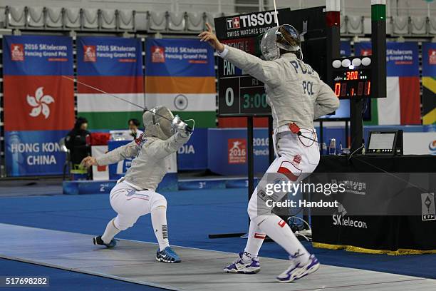 In this handout image provided by the FIE, Eileen Grench of Panama and Marta Puda of Poland compete during the individual Women's Sabre match during...