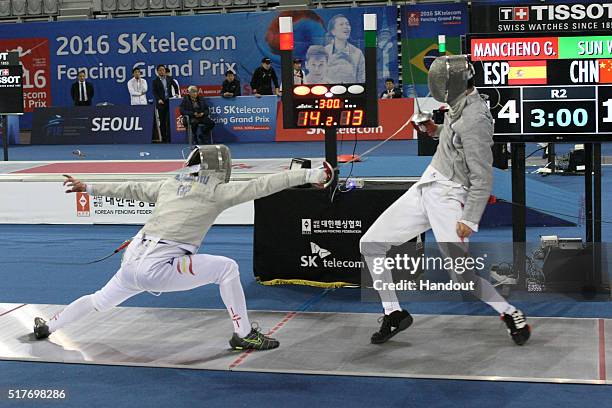 In this handout image provided by the FIE, Guillen Macheno of Spain and Sun Wei of China compete during the individual Men's Sabre match during day 1...