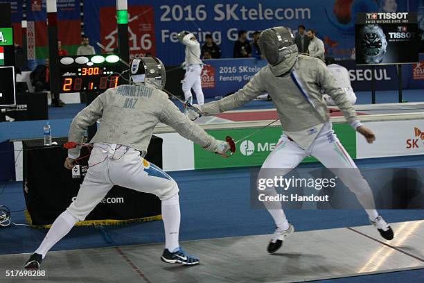 In this handout image provided by the FIE, Ilya Mokretcov of Kazakhstan and Andras Szatmari of Hungary compete during the individual Men's Sabre...