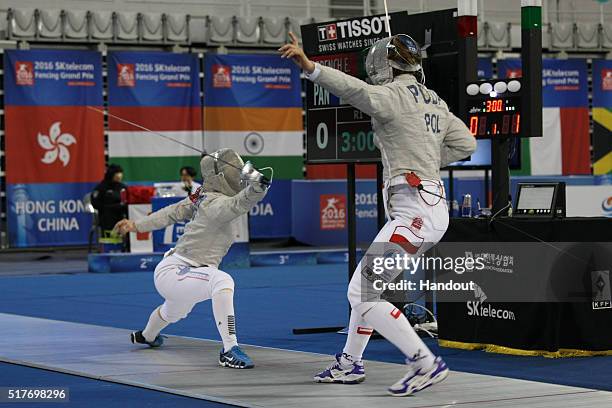 In this handout image provided by the FIE, Eileen Grench of Panama and Puda Marta of Poland compete during the individual Women's Sabre match during...