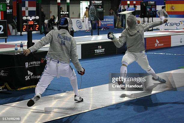 In this handout image provided by the FIE, Alberto Pellegrini of Italy and Edward Barloy of France compete during the individual Men's Sabre match...