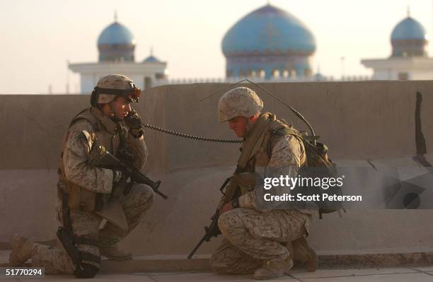 Marine Lt. Michael Aubry , from Arlington Heights, Illinoi, of the 1st Light Armored Reconnaissance company makes a radio call, November 20, 2004 in...