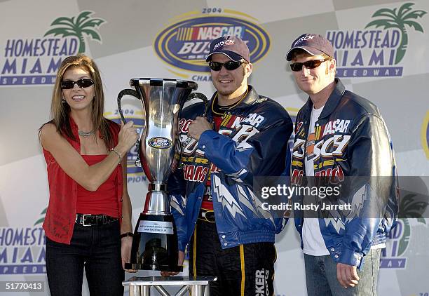 Teresa Earnhardt, Martin Truex Jr., and Dale Earnhardt Jr., celebrate winning the NASCAR Busch Series Championship following the NASCAR Busch Series...