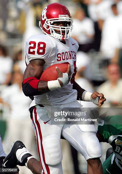 Running back Adrian Peterson of the University of Oklahoma Sooners rushes for a touchdown against the Baylor University Bears on November 20, 2004 at...