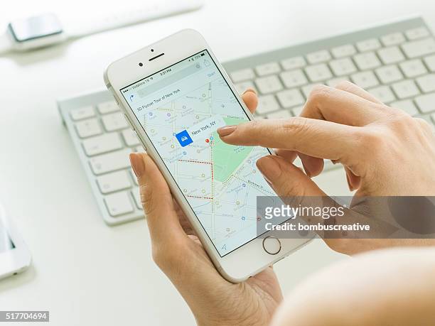 smartphone mapping while in office - editorial office stock pictures, royalty-free photos & images