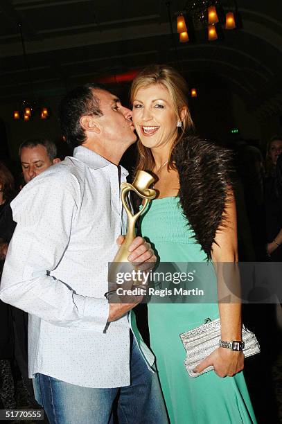 Alan Fletcher holding his Variety 2004 Outsanding Contribution Award and wife Australian news reader Jennifer Hansen attend the after party of the...