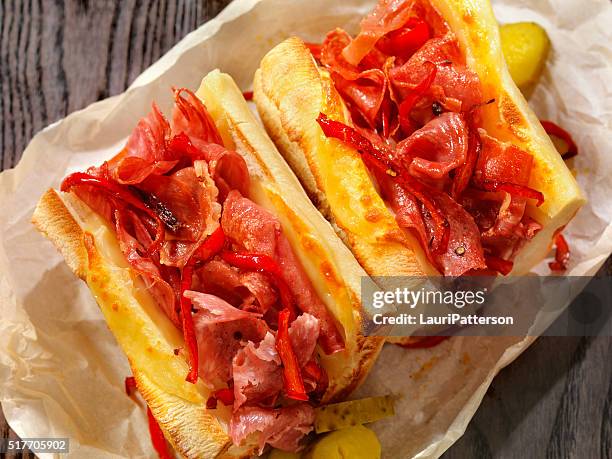 toasted italian sandwich with roasted red peppers - wax paper stock pictures, royalty-free photos & images