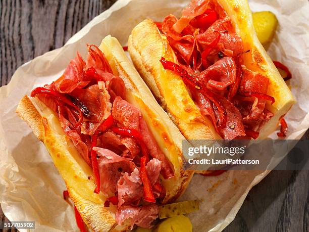 toasted italian sandwich with roasted red peppers - prosciutto stock pictures, royalty-free photos & images