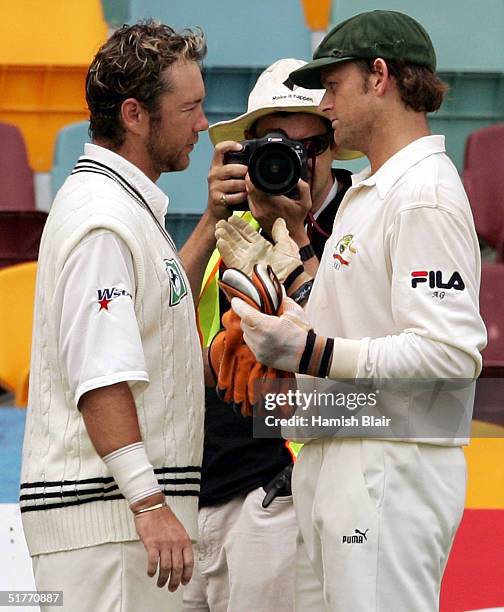 Adam Gilchrist of Australia and Craig McMillan of New Zealand discuss an incident where McMillan appeared to edge a ball but didn't walk during day...