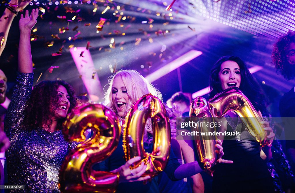 Friends celebrating New Years eve with a night club party