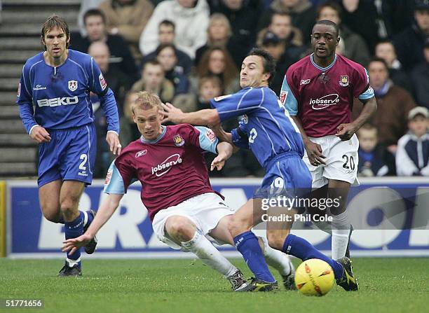 Luke Chadwick of West Ham clashes with Dennis Wise of Millwall during the Coca-Cola Championship match between Millwall and West Ham United at the...