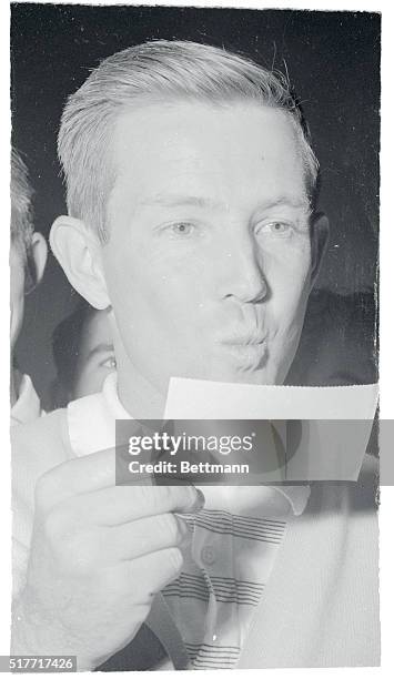 Gene Littler, the blond bomber of the links, gives his $5,000 check for winning the Los Angeles Open a playful buss. The 23 year old former National...