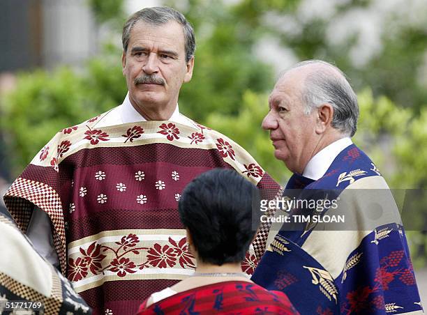 Mexican President Vicente Fox stands with Chile's President Ricardo Lagos before the APEC Official Leaders Photograph session in Los Naranjos Court...
