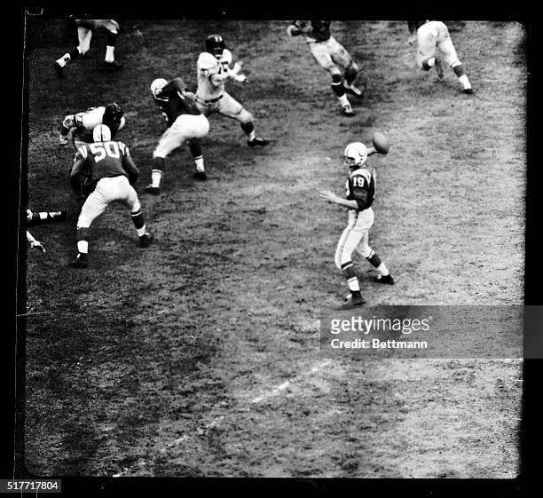 Johnny Unitas , of the Baltimore Colts, passes during the Pro-Championship game won by Baltimore over the NY Giants, 31-16.