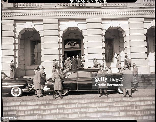 Washington, DC- Accompanied by Mrs. Eisenhower and Assistant Capitol Architect, Gus Cook, President Eisenhower is shown leaving the House Wing of the...