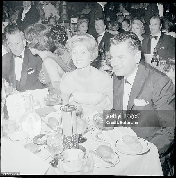 Debbie Reynolds and Glenn Ford appeared to be a happy couple among the many Hollywood stars attending the Golden Globe Awards sponsored by the...