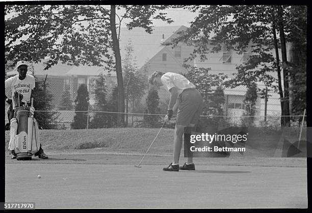 Blonde Mickey Wright of Dallas sinks a putt in the first round and fired a three-under par 34-35-69 for a 221, which gave her the early third round...