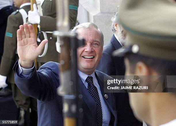 Canadian Prime Minister Paul Martin waves as he enters at La Moneda Presidential Palace, to attend the opening of the APEC leaders' 2nd retreat. AFP...