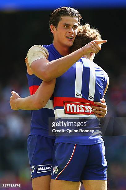 Tom Boyd and Jack Macrae of the Bulldogs celebrate kicking a goal during the round one AFL match between the Western Bulldogs and the Fremantle...