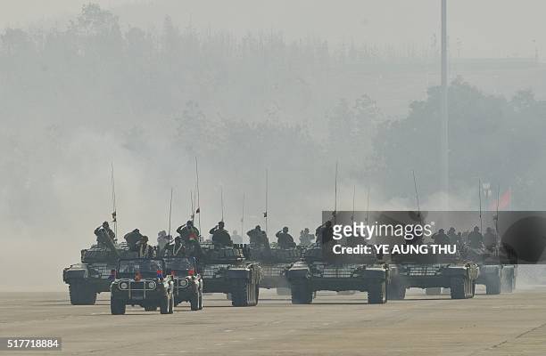 Myanmar military tanks are paraded during a ceremony to mark the 71st Armed Forces Day in Myanmar's capital Naypyidaw on March 27, 2016. / AFP / YE...