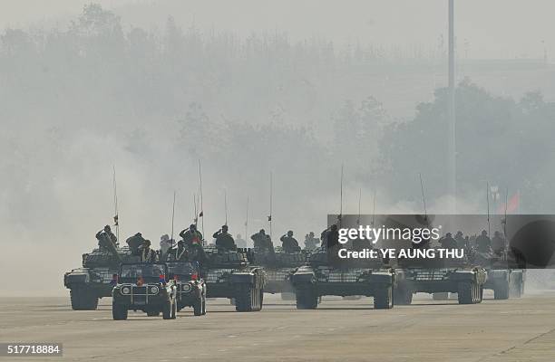 Myanmar military tanks are paraded during a ceremony to mark the 71st Armed Forces Day in Myanmar's capital Naypyidaw on March 27, 2016. / AFP / YE...