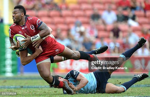 Samu Kerevi of the Reds attempts to get a pass away during the round five Super Rugby match between the Reds and the Waratahs at Suncorp Stadium on...