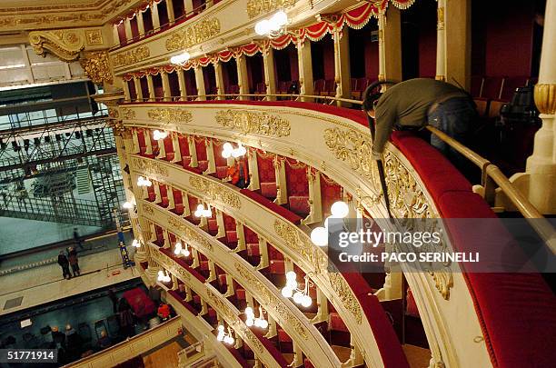 Worker gives the last cleaning,19 November 2004, on a balcony of the Milan's La Scala opera house. The famous opera house is set to reopen its doors...