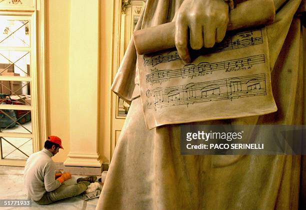 Worker gives the last cleaning,19 November 2004, next to a Gaetano Donizetti's statue in the Milan's La Scala opera house. The famous opera house is...