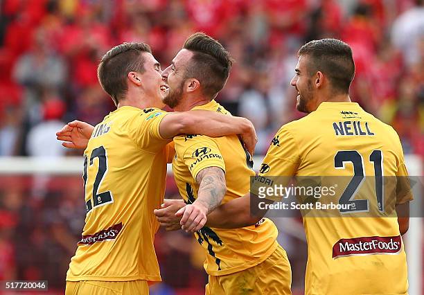 Roy O'Donovan of the Mariners celebrates with his teammates after scoring the first goal during the round 25 A-League match between Adelaide United...