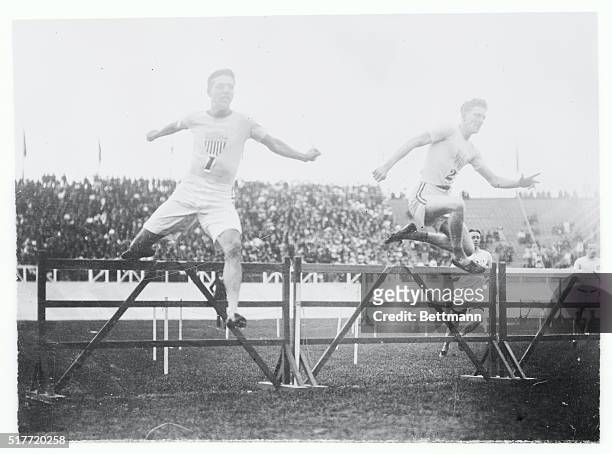 Olympic Games, London, England 1908. 400 meters hurdles, the 3rd hurdle, left to right: Harry Hillmand, U.S.A. 2nd and Charles Bacon, U.S.A 1st.