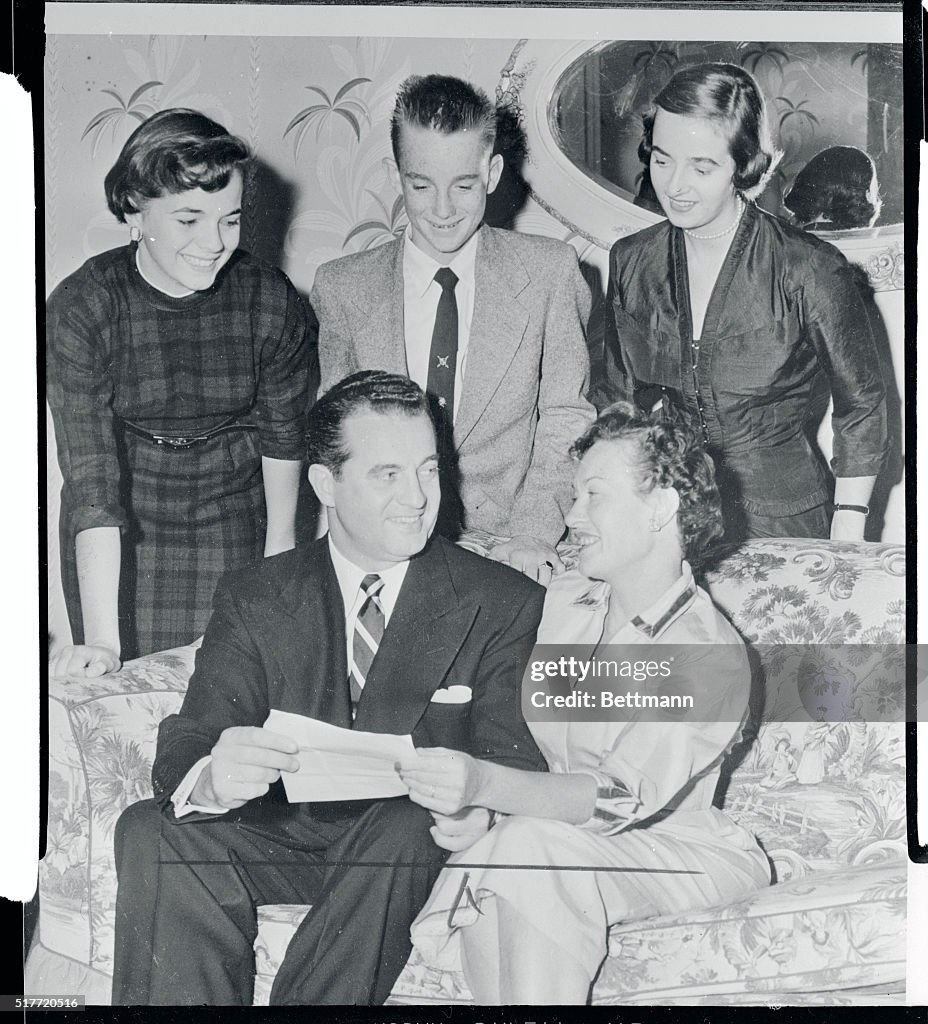 Charles F Murphy Reading Telegrams with His Family