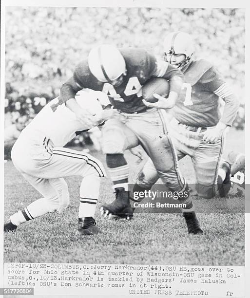 Jerry Harkrader, , of Ohio State scores a touchdown in the fourth quarter of the October 23rd game with Wisconsin. He is tackled by the Badger's...