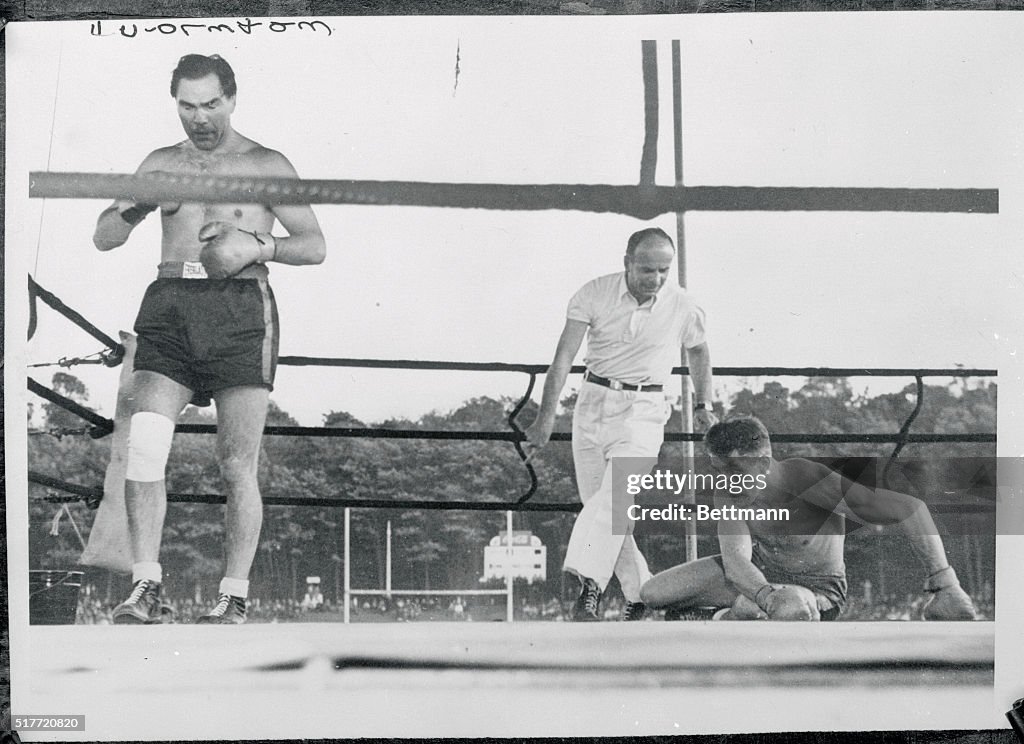 Referee Counting Out a Downed Boxer