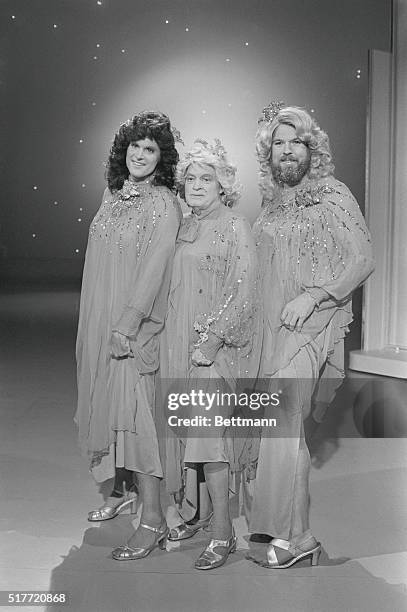 Hollywood: There they were. The "Mandrake Sisters", in flaming red dresses and high heels, singing "Take This Job And Stuff It." On closer...