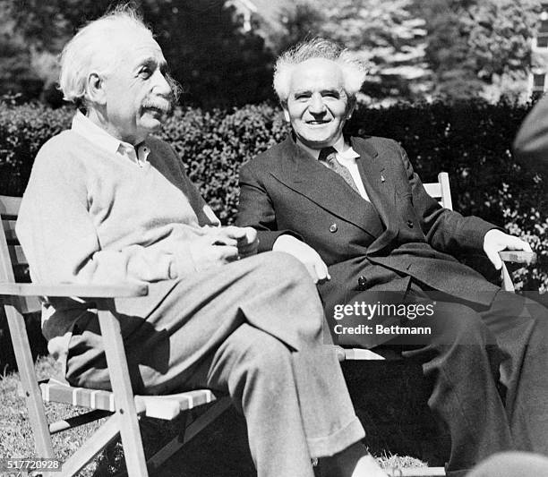 Physicist Albert Einstein and David Ben-Gurion, first prime minister of Israel, relax in Einstein's backyard.