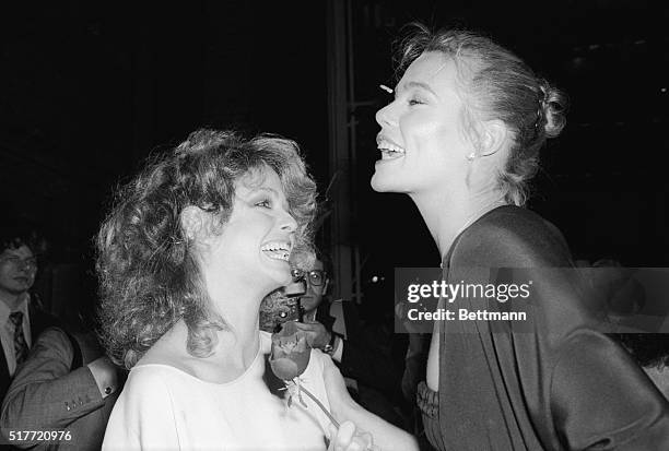 Farrah Fawcett surrounded by photographers at Studio 54 during a party sponsored by Faberge, which introduced a new line of hair products for the...