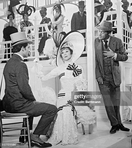 Eliza Doolittle , sings to Freddie Eynsford-Hill , and Professor Henry Higgins in My Fair Lady. | Version of: 'Pygmalion' by George Bernard Shaw.