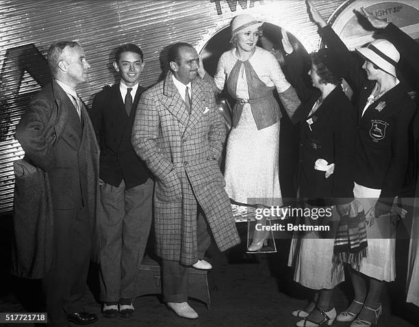 Cosmopolitan group greets Mary Pickford on her arrival in Los Angeles from New York City via plane. Miss Pickford is a sponsor to women athletes...
