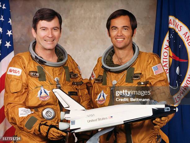 These two astronauts are the prime crewmen for the first flight in the Space Transportation System program. Astronauts John W. Young, left, crew...