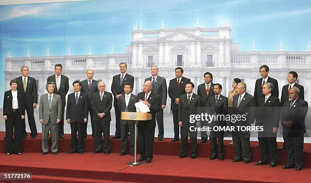 Chile's President Ricardo Lagos accompanied by the APEC members' leaders, delivers a speech during the closing ceremony of the Asia-Pacific Economic...