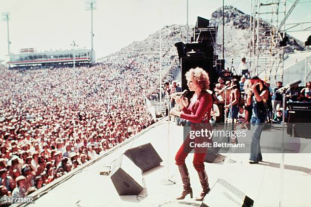 Barbra Streisand performing at an outdoor concert in a scene from the Warner Brothers 1976 film, A Star is Born, directed by Frank Pierson.