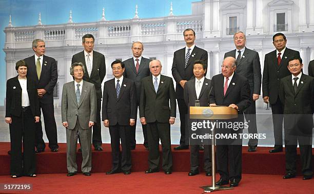 Chile's President Ricardo Lagos accompanied by the APEC members' leaders delivers a speech during the closing ceremony of the Asia-Pacific Economic...