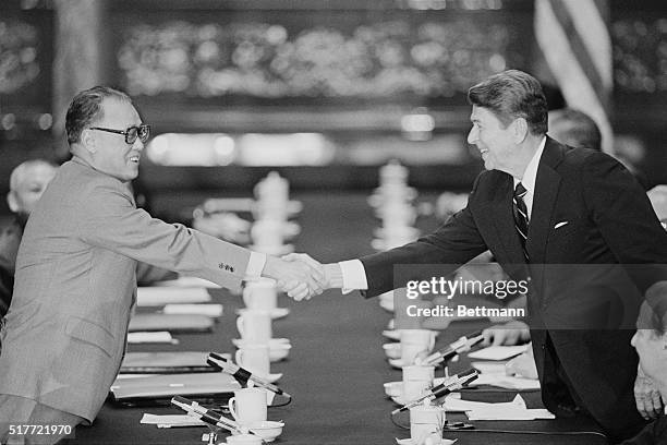 Peaking, China: Chinese premier Zhao Ziyang and President Reagan shake hands at the conclusion of their meeting at the Great Hall of the People.